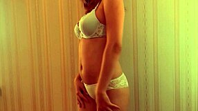 This amateur video shows a hot babe making you watch her strip and tease you