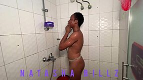 A couple of ebony hotties spend some time having a topless bath together, although Natasha is the main star of the scene