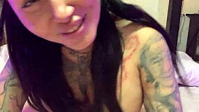 Tattooed model showcases skills for deepthroating in a verification video