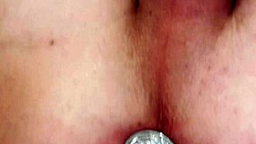 Masturbating with a butt plug