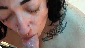 Pretty tattooed girl performs oral sex in a pov perspective