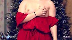Kira in a red dress] barely revealing her small breasts with big nipples