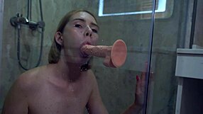 A hot woman masturbates with a toy in the bathroom