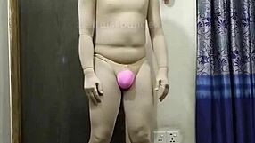 Converting a penis into a zentai suit and undergoing surgery to implant the device while under anesthesia