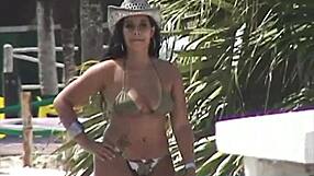 Sex on a beach towel than outdoor sexual acrobatics with strap on while she wore a pair of shorts