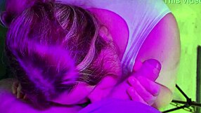 An overly endowed teenage girl gives another man oral sex during a party