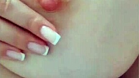 Young naked college girl lies on a bed and having fun, making herself orgasme in a luxurious manner