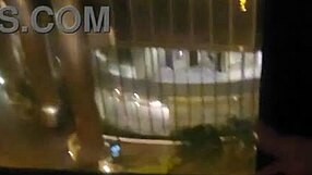 Ejaculation in an open place by a hotel window