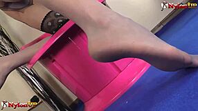 Hey, watch Lady Scarlet give a kinky footjob in pantyhose