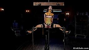 Hanging Slave in BDSM Equipment and Corset