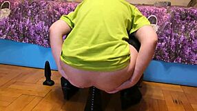 The mistress, Anastasia, puts on her massive dildo and takes anal pleasure