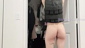 A quite sizeable Asian woman, very muscular and fit, performs her conventional archery and weighted pull ups in the nude