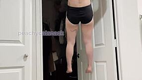 A quite sizeable Asian woman, very muscular and fit, performs her conventional archery and weighted pull ups in the nude