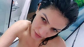 A busty Latina in the shower teases with her big ass and tits