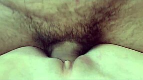 From the lens of a pornographic film, an amatuer woman enjoying a creampie