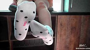 Pretty feet in socks and jeans, a fetish lover’s delight.