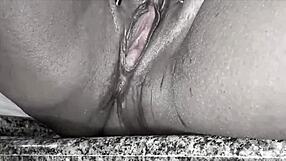 A homemade video of a big-chested brunette with a big black cock