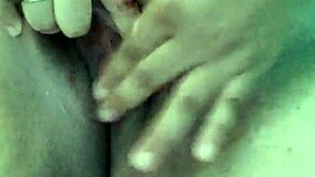 Hot stepmom enjoys solo play in the bathtub