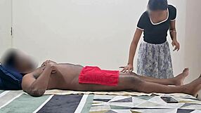 Indian guy gets a massage with his wife watching