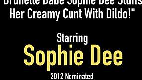Sophie Dee's solo performance with a blue dildo in a bikini bikini