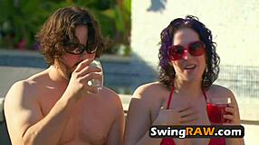 A petite brunette gets some fun in the water at a hot swinging party