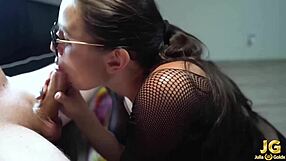Glasses wearing brunette gets her hands dirty with a deepthroat and handjob