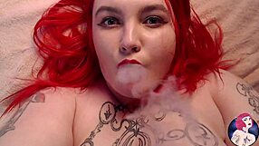 Sensual redheaded beauty shows off her big natural tits
