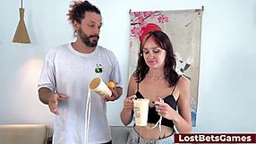 A hot strip cup game with a horny couple