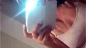 A squirting teen masturbates in front of a webcam