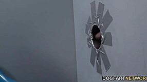 Edyn Blair has fun with two black rods at a gloryhole