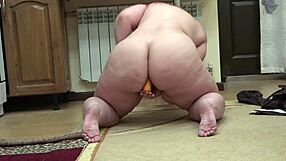 Redhead MILF enjoys anal masturbation and big booty shaking