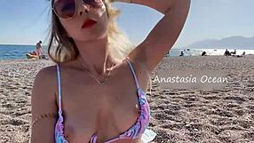 Public beach babe shows off her sexy body outdoors
