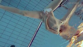 Nastya’s tiny dress shows off her small yet sexy Russian ass while swimming in the pool