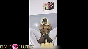Shaved black beauty enjoys hardcore dildo action