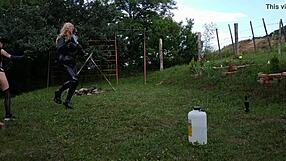 Petite BDSM Mistress trains her shemale slave outdoors