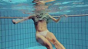 Nastya’s tiny dress shows off her small yet sexy Russian ass while swimming in the pool
