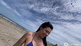Tattooed Latina gets fisted and facialized on the beach