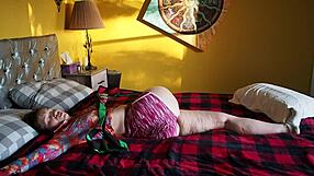 Aurora Willows, a Russian MILF, shows off her big ass while posing on the bed