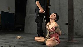 Beautiful woman gets flogged and has her breasts fondled while gagged