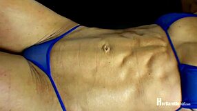 Muscle worship with a female bodybuilder in a string bikini