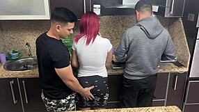 Wife and husband cooking together while friend seduces her