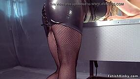 Dominant man in fishnet BDSM scene with busty lesbian couple