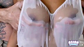 Asian flat chested cutie gets oiled up and masturbates