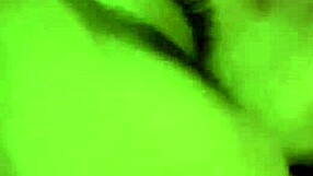 Close up of a face that is about to lick a pair of balls