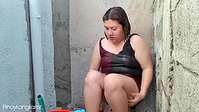 Pretty Filipino woman gets washed and fucked in a bath tub outside her home