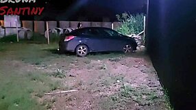 A brunette gives a blowjob to a big black cock in the parking lot of a luxury nightclub