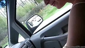 Young beauty helps a man to pleasure himself while driving a car and gets caught on camera