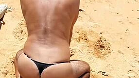 Hot shemale Ladysilva shows off her ass on the beach in panties
