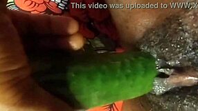 Cyndy, the black slave enjoys a cucumber insertion with a squirting orgasm