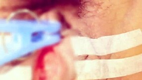 Gay BDSM clitoral stimulation with an electric vibe